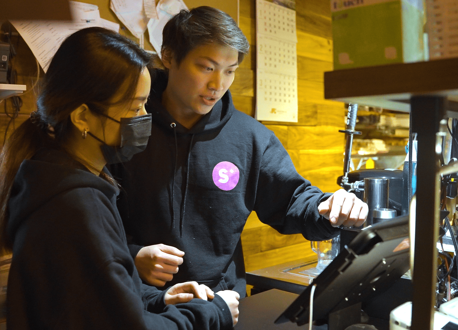 People using the Snappy POS system.